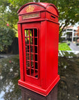 Red telephone booth with a 'Telephone' label
