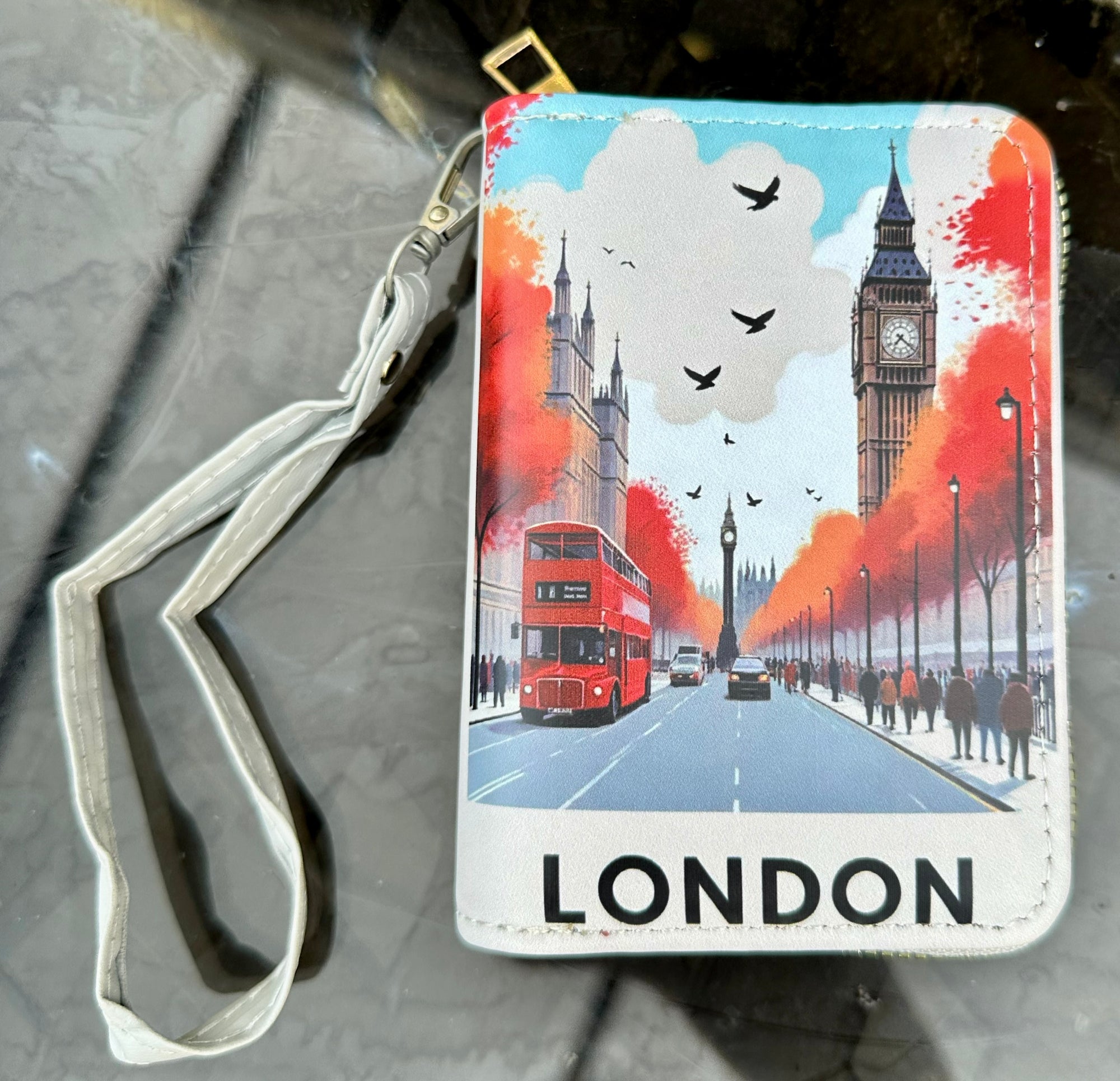 purse with London-themed design featuring Big Ben and a red bus.