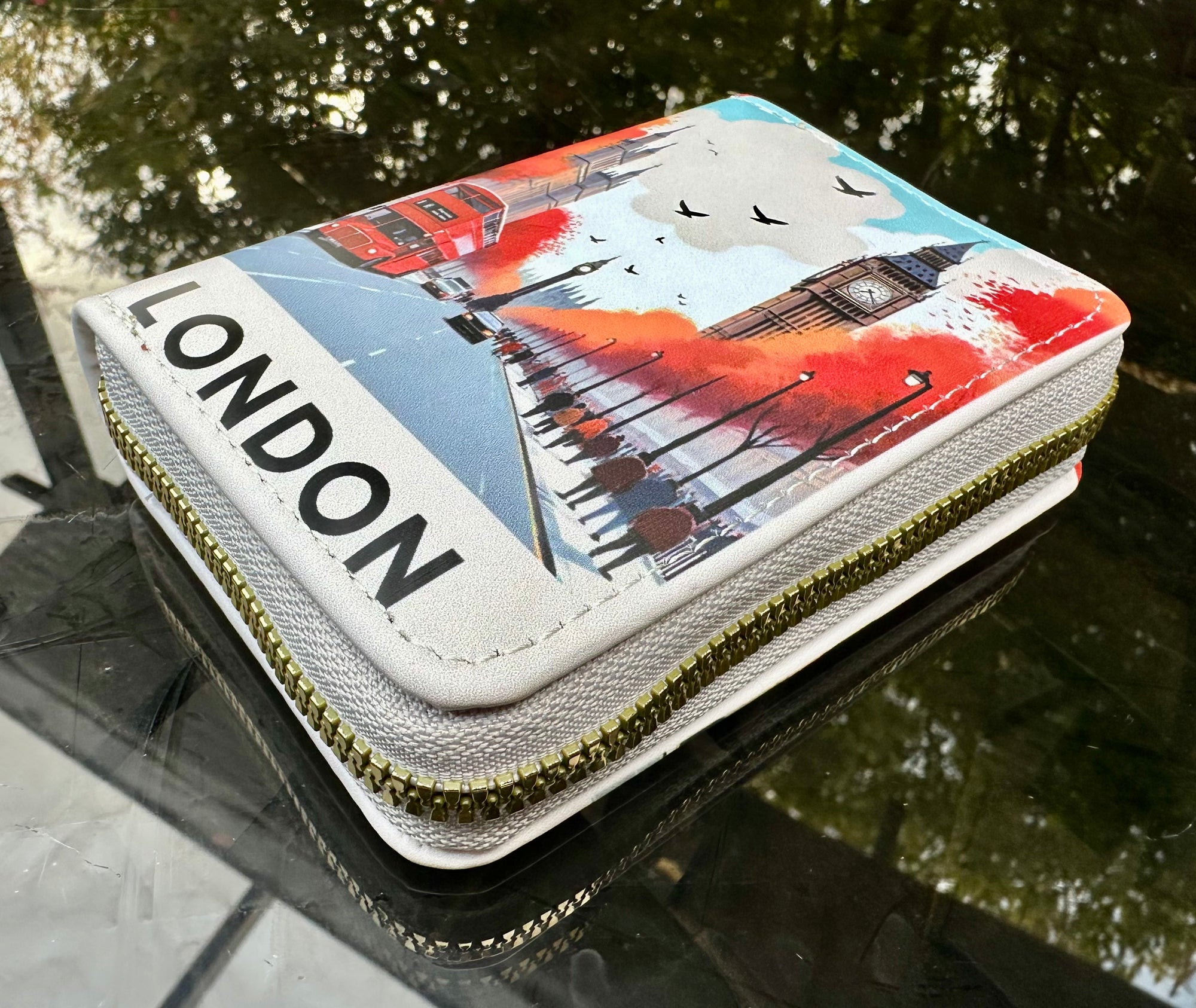 Wallet with 'London' design featuring a cityscape and red double-decker bus.