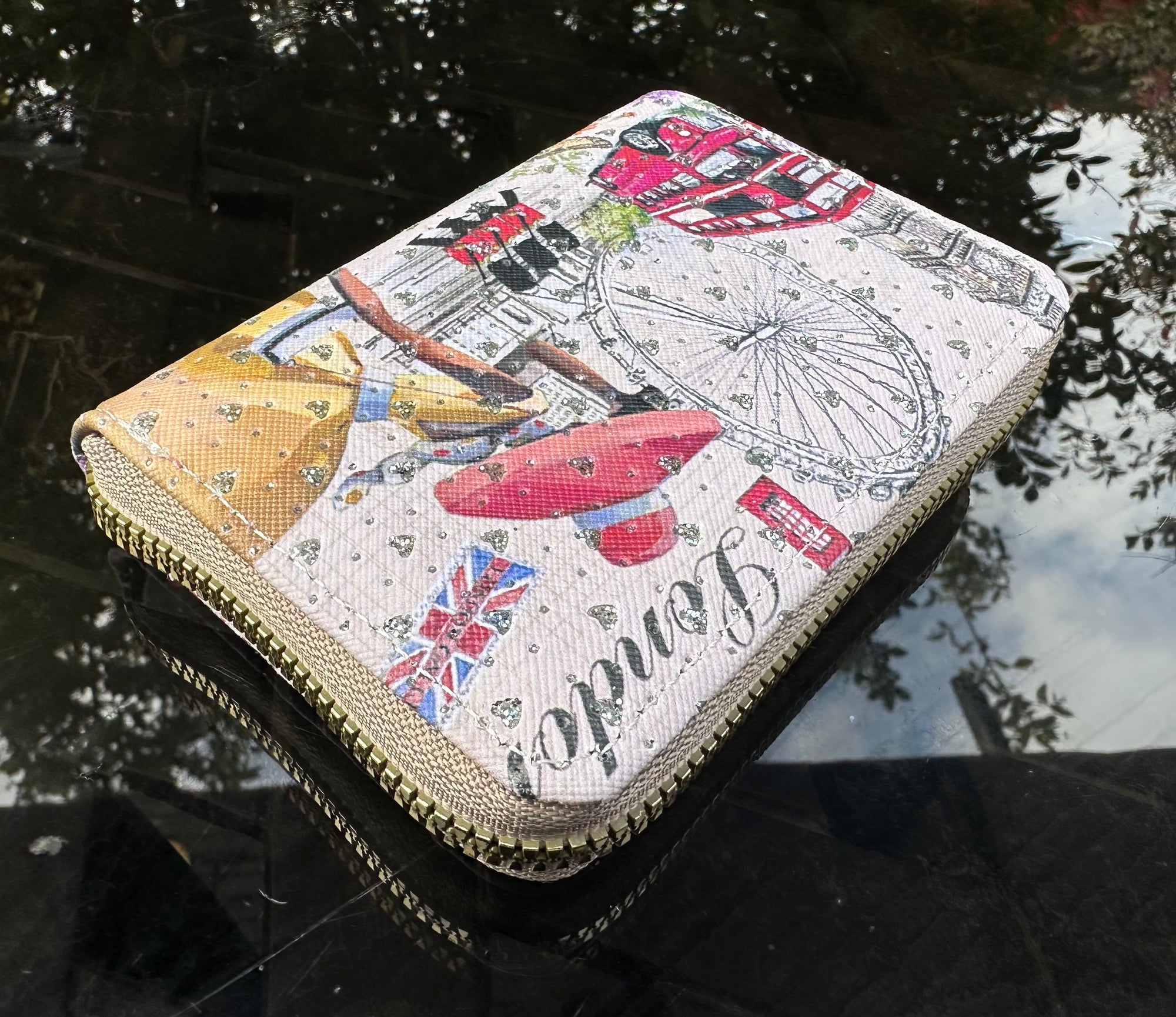 Designer wallet with london travel-themed design 