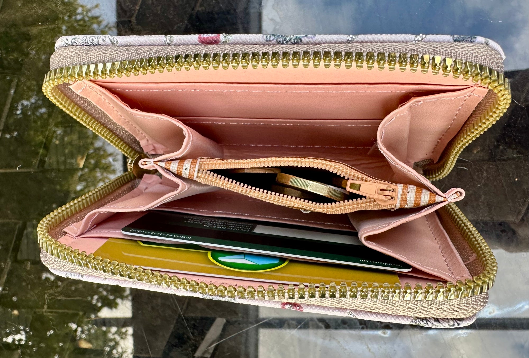 Open wallet with gold zipper 