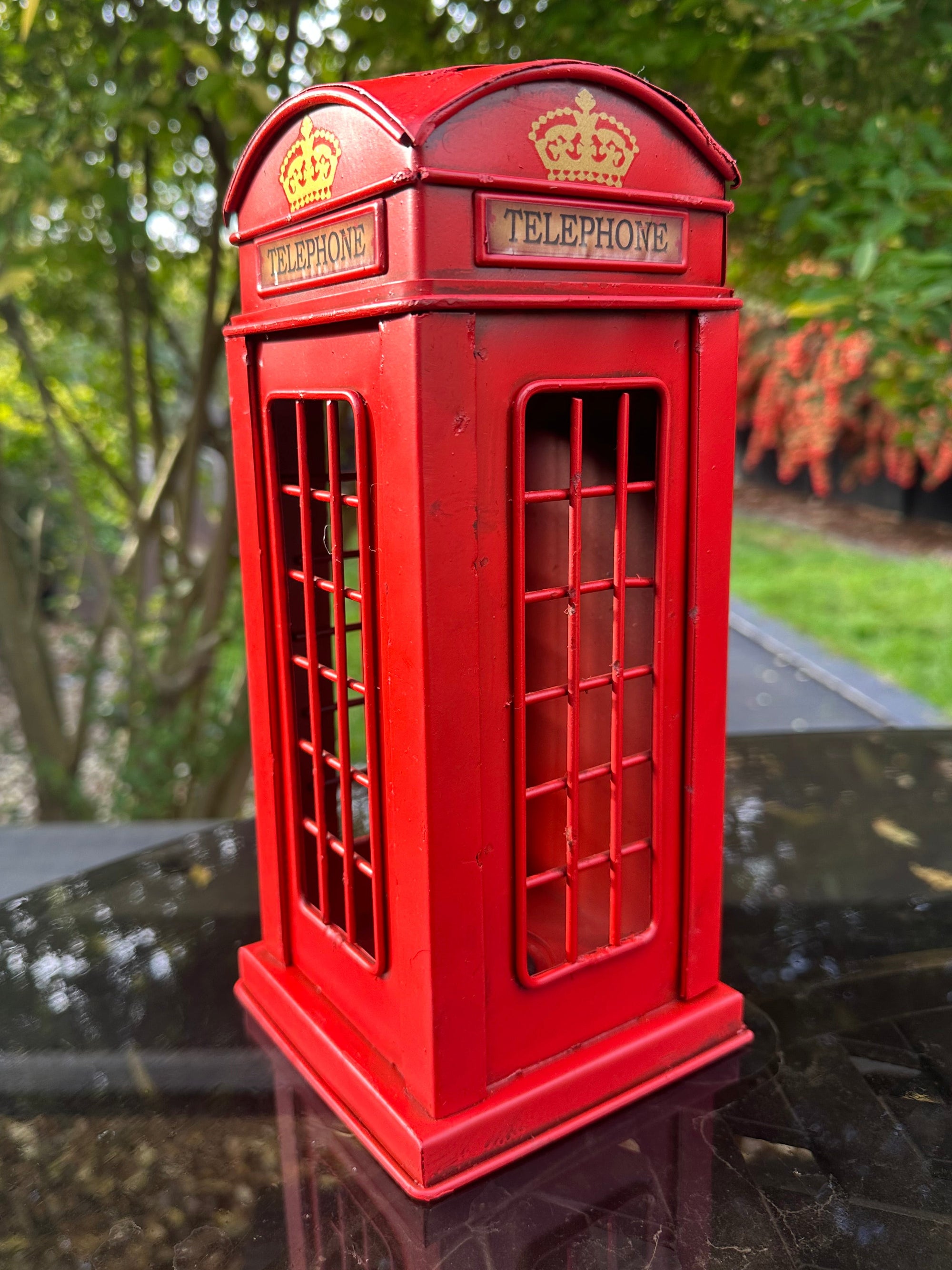 Red telephone booth model with 'Telephone' label 