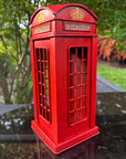 Red telephone booth model with 'Telephone' label 